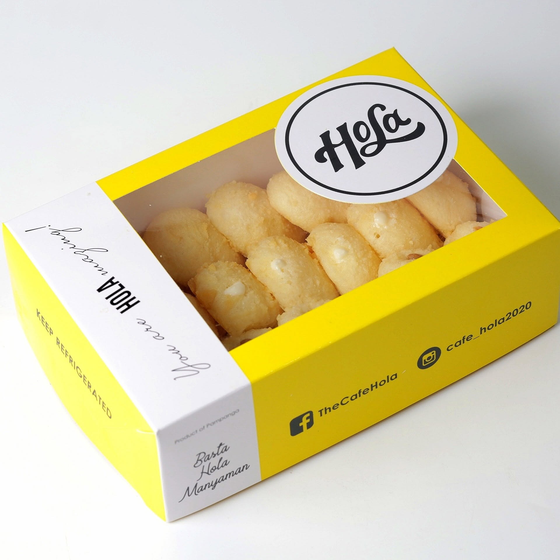 Hola Milky Cheese Bread Bites — bite-sized golden bread bites in an open yellow Hola box with the Basta Hola Manyaman tagline